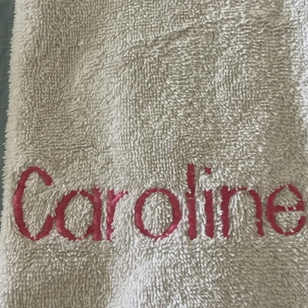 Two Raffia hand towels monogrammed with Caroline